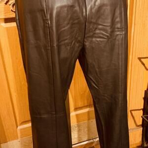 Black leather trousers with tags. Zipper on the side of the hip stunning and has